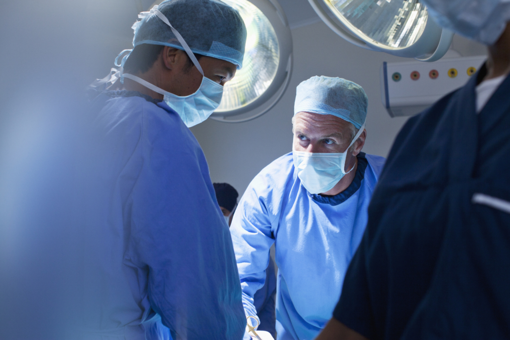 Surgeons working in operating room